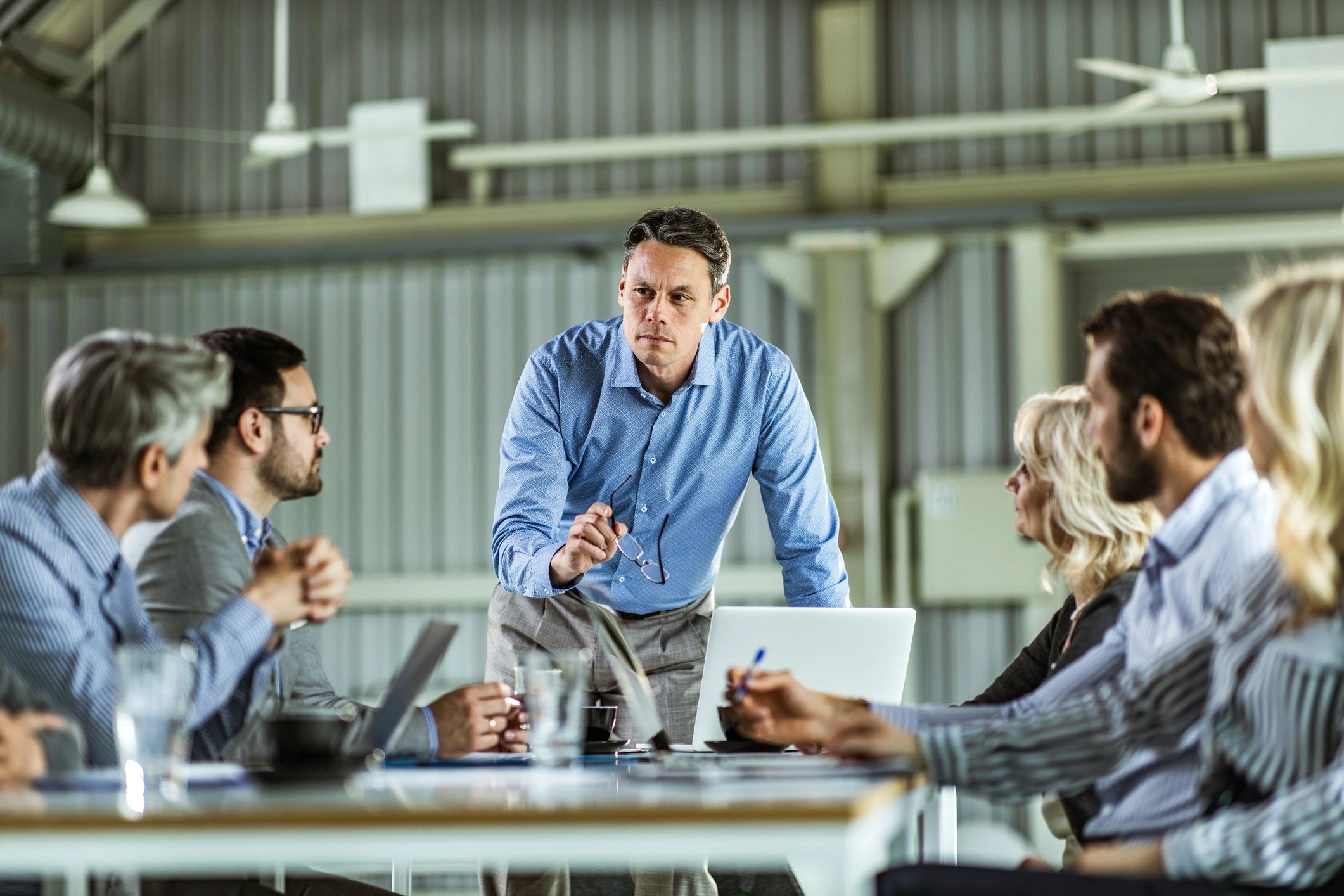 Engineering leadership team meeting in a modern office