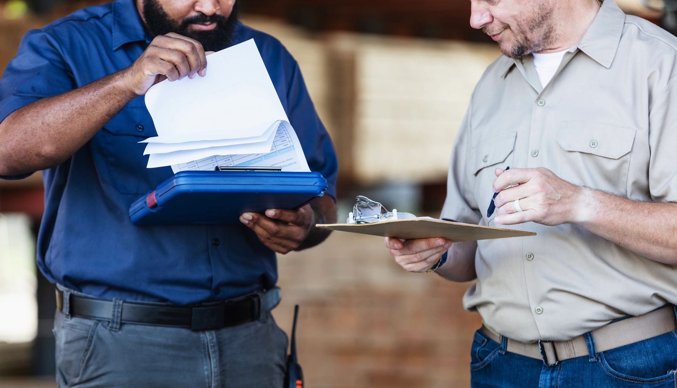 Engineers reviewing documentation and checklists during a site walkthrough